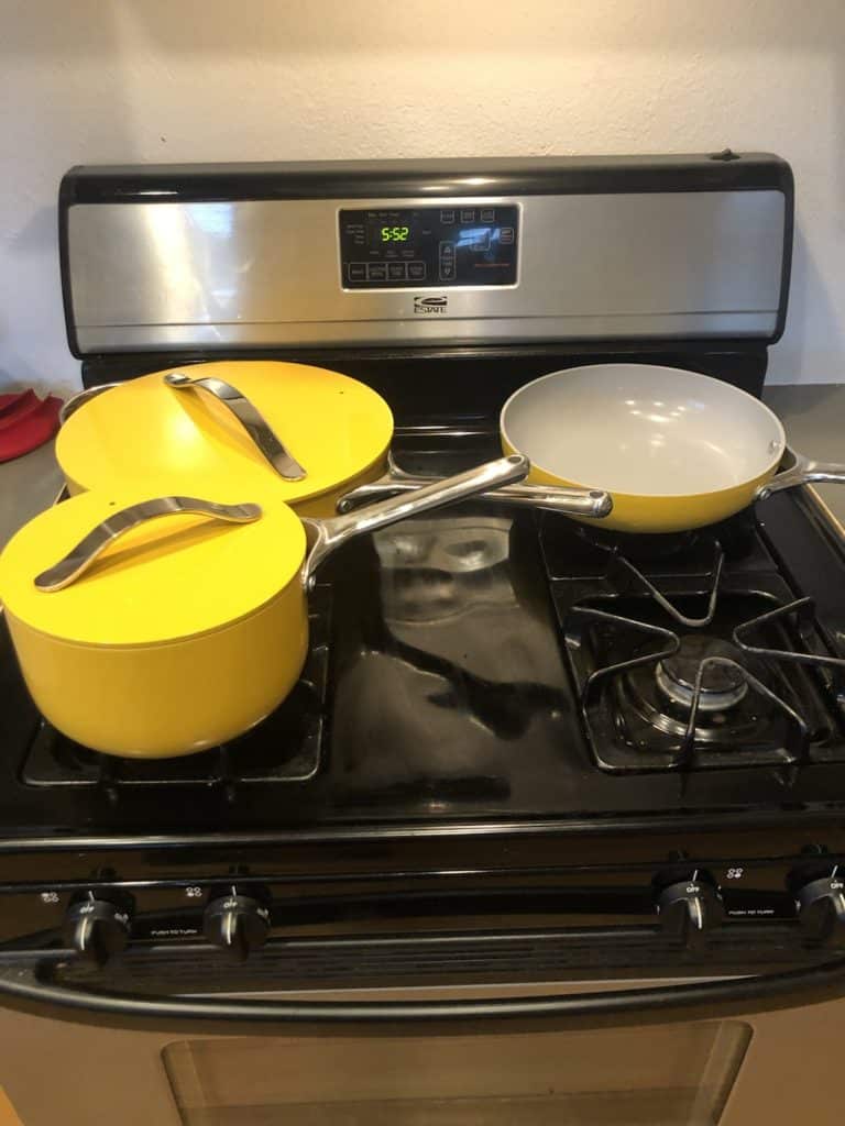 Caraway cookware set in marigold.